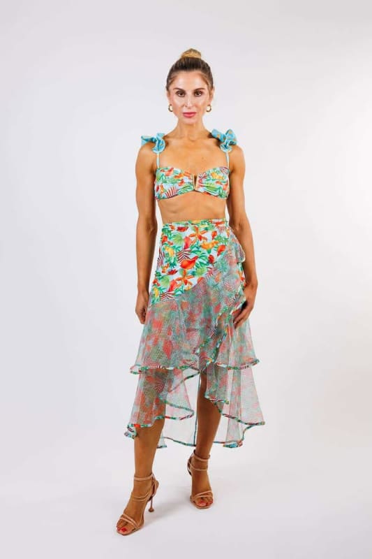 Model wearing the Sofia Wrap Skirt by Zinzina Swimwear, styled for luxury coastal escapes