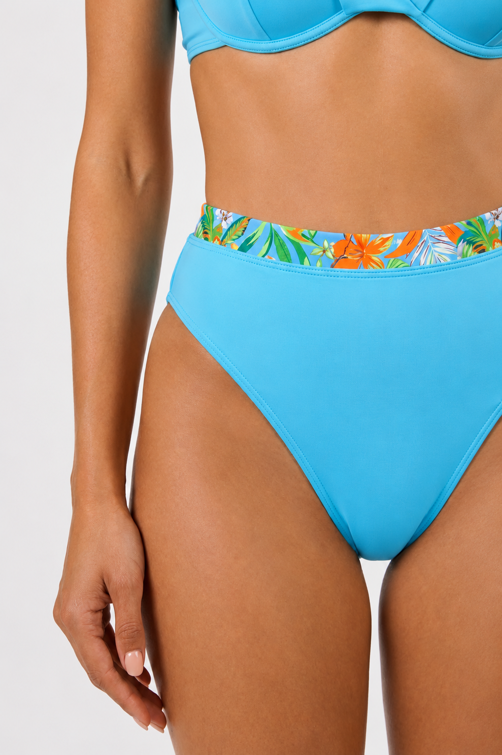 The model is wearing an Allegra Underwire Bikini Set at studio set background.