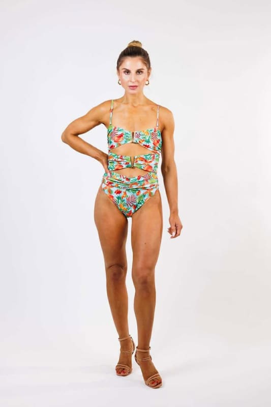 Model wearing the Adelina One Piece Swimsuit by Zinzina Swimwear, styled for luxury coastal escapes