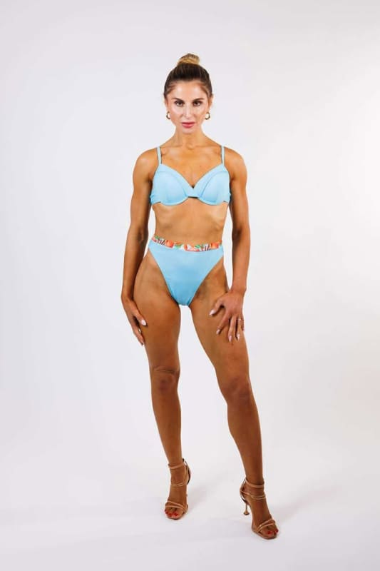 Model wearing the Allegra Underwire Bikini Top by Zinzina Swimwear, styled for luxury coastal escapes