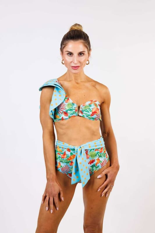 Model wearing the Cinzia High Waist Bikini Bottom by Zinzina Swimwear, styled for luxury coastal escapes