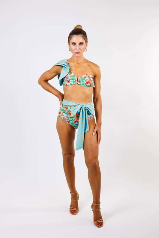 Model wearing the Cinzia High Waist Bikini Bottom by Zinzina Swimwear, styled for luxury coastal escapes