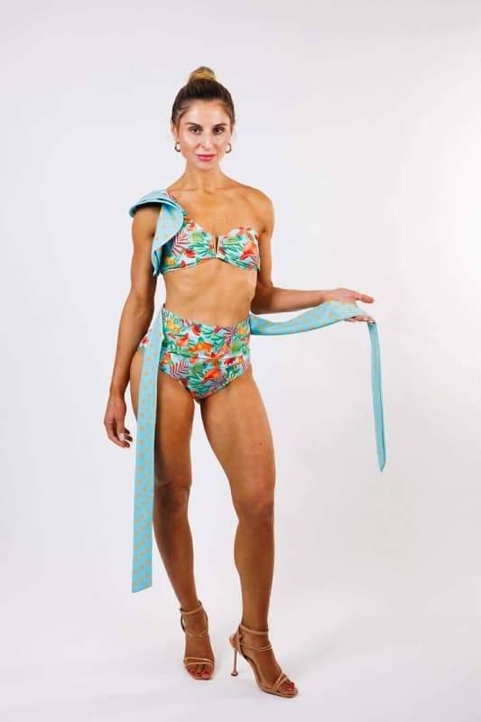 Model wearing the Cinzia High Waist Bikini Bottom by Zinzina Swimwear, styled for luxury coastal escapes