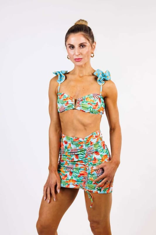 Model wearing the Gisela Mini Skirt by Zinzina Swimwear, styled for luxury coastal escapes