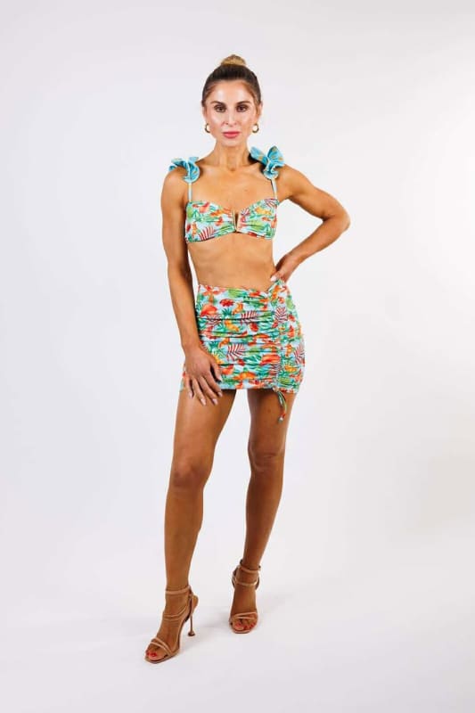 Model wearing the Gisela Mini Skirt by Zinzina Swimwear, styled for luxury coastal escapes