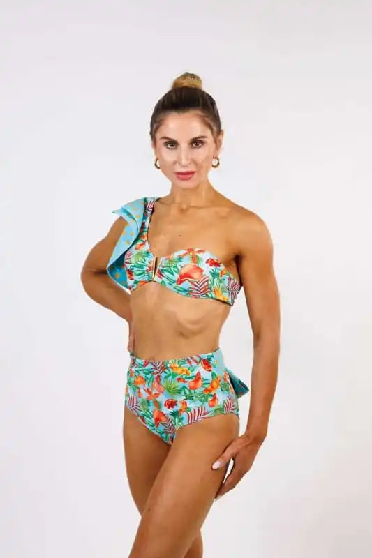 Model wearing the Cinzia Bandeau Bikini Top by Zinzina Swimwear, styled for luxury coastal escapes